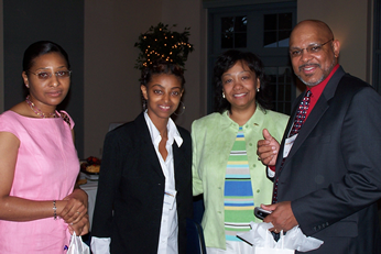 Second-year dental student (second left) flanked by several dentists in attendance 